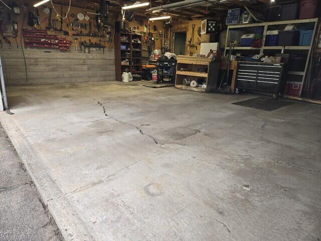 Cracked Garage Floor Leveled and Cracks Repaired in Tomahawk, WI - Before Photo