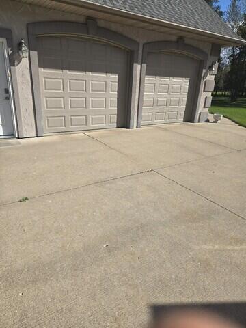 Concrete Driveway Lifted, Leveled, and Sealed in Nekoosa, WI - Before Photo