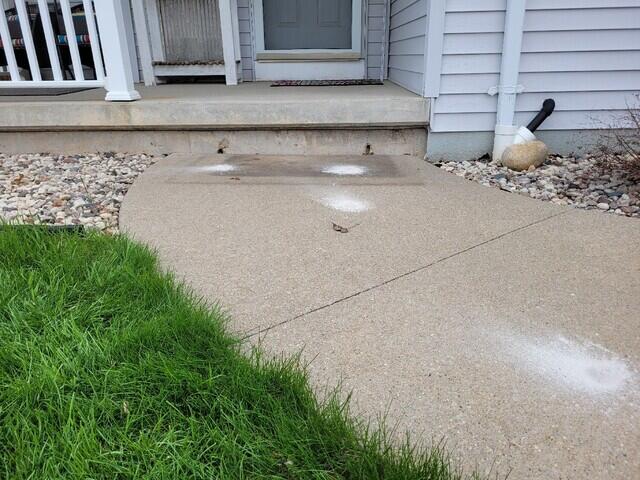 Concrete Sidewalk Leveling & Sealing in Menasha, WI - Before Photo