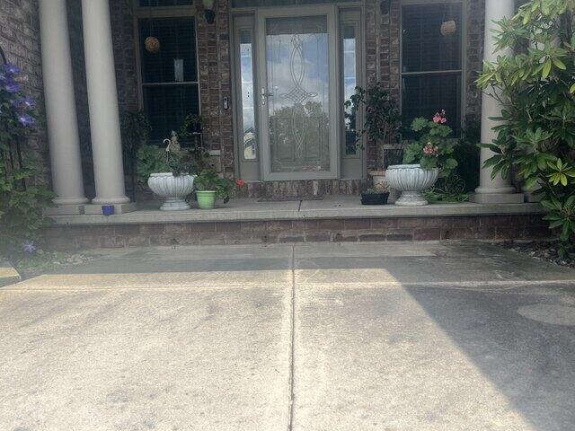 Sunken & Unlevel Concrete Lifted, Repaired & Joints Sealed in Neenah, WI - Before Photo