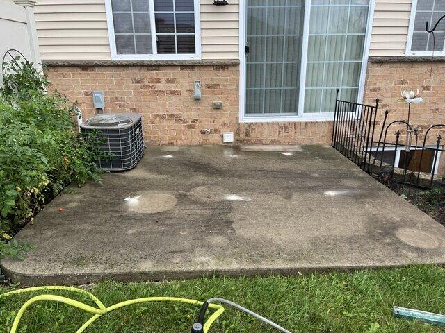 Sunken Back Patio Concrete Repaired & Sealed in De Pere, WI - Before Photo