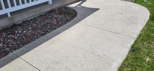 Concrete Sidewalk Repair In Hilbert, WI - Before Photo