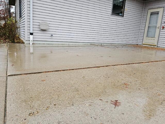 Concrete Sidewalk and Garage Apron Repair in Nekoosa, WI - Before Photo