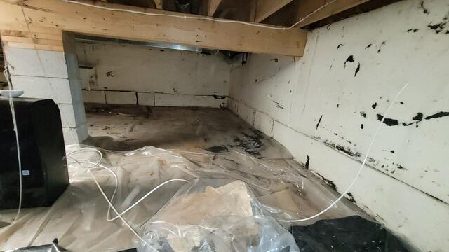 Musty Crawl Space Issues Resolved with Encapsulation Lining and Air Purification System in Keshena, WI - Before Photo