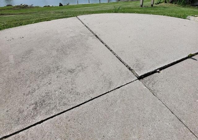 Cracked and Sunken Concrete Driveway Repaired In Chilton, WI - Before Photo