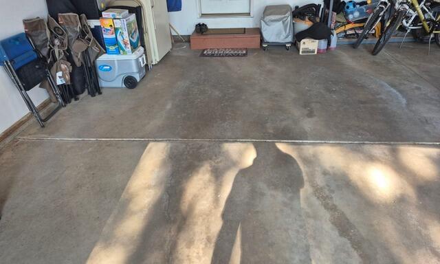 Concrete Garage Floor Cracks Sealed and Repaired in Laona, WI - Before Photo