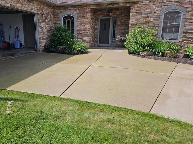 Sunken and Cracked Concrete Repaired & Stabilized In Schofield, WI - Before Photo