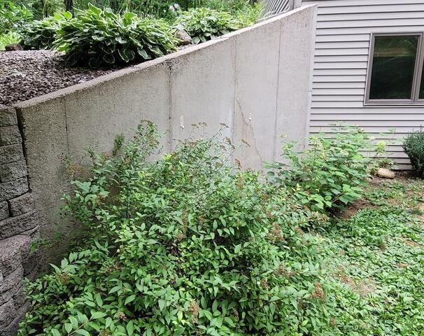 Retaining Wall Risks Falling Before GeoLock Installation In Amherst Junction, WI - Before Photo
