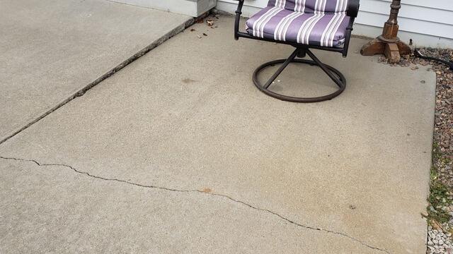 Concrete Sidewalk Lifted with PolyLevel Foam in Pulaski, WI - Before Photo