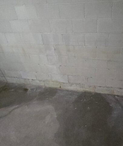 Wet Basement Repaired with Upgrades Sump Pump and Water Control System in Kronenwetter, WI - Before Photo