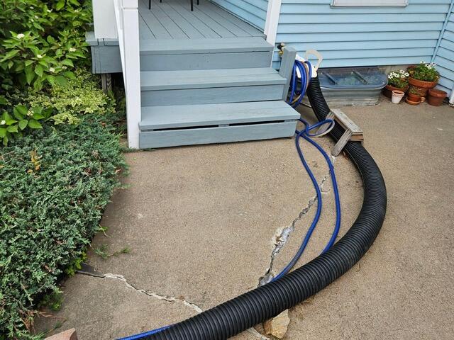 Buried Sump Pump Discharge Line Installed in Schofield, WI - Before Photo