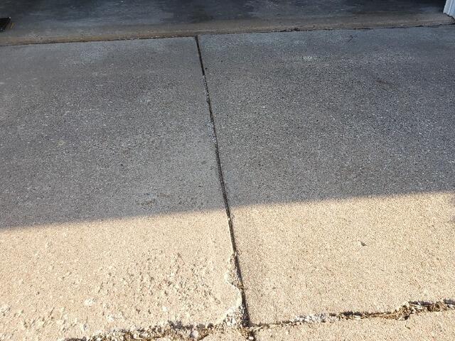 Permanent Concrete Lifting & Leveling of Garage Entry in Marshfield, WI - Before Photo