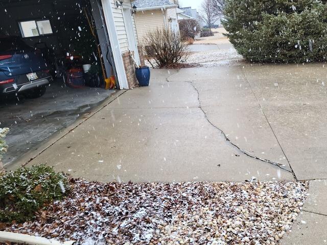 Cracked Driveway Repaired in Fond Du Lac, WI - Before Photo