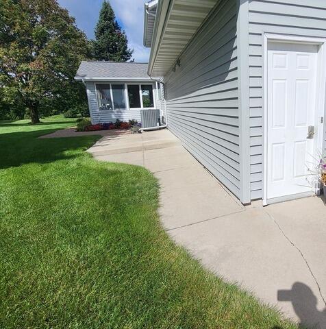 Uneven Concrete Driveway Lifted and Leveled in Greeville, WI - Before Photo
