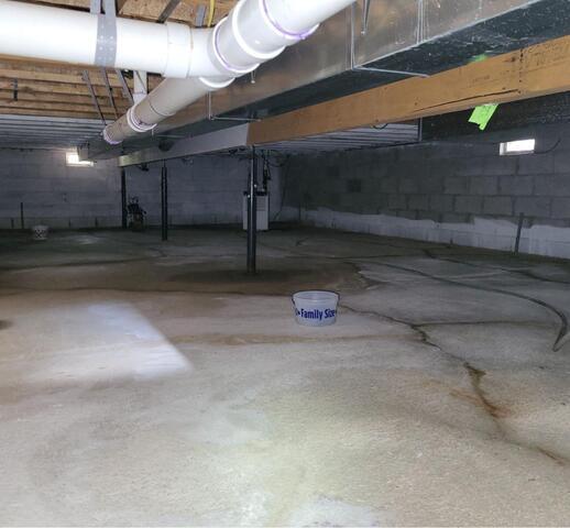 Water Control System & Sump Pump Solves Crawl Space Flooding Issues in Porterfield, WI - Before Photo
