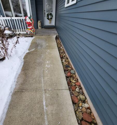 Concrete Walkway Lifted, Leveled and Joints Sealed in Malone WI - Before Photo