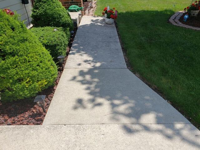 Concrete Sidewalk Trip Hazards Resolved with PolyLevel Injection Foam in New Holstein, WI - Before Photo