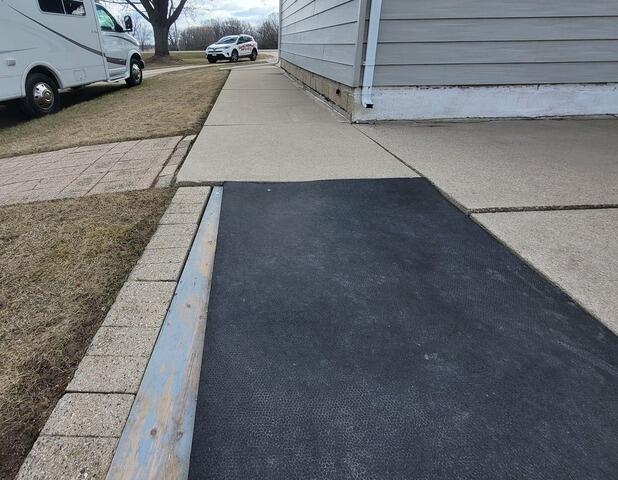 Concrete Leveled and Trip hazards corrected with PolyLevel in Van Dyne, WI - Before Photo