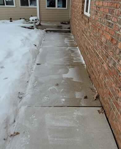 Concrete Walkway Lifting and Joint Sealing in Shawano, WI - Before Photo