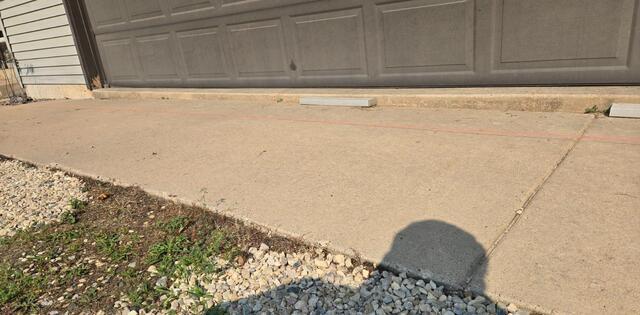 Garage Apron Lifted, Leveled and Stabilized in Iola, WI - Before Photo