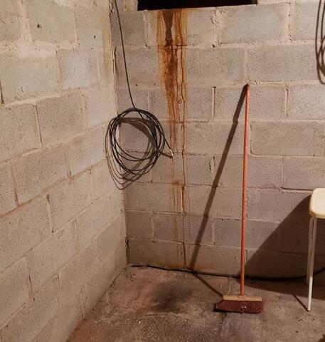 Basement Water Issues Resolved with Updated Drainage & Sump Pump Systems in Washington Island, WI - Before Photo