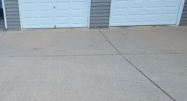 Sunken Concrete Driveway Lifting & Repair in Florence, WI - Before Photo