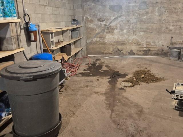 Wet Basement Repaired & Stabilized in Fence, WI - Before Photo
