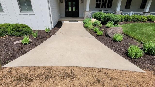 Sunken Concrete Garage Apron and Walkway Raised in Redgranite, WI - Before Photo