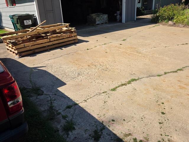 Cracked Concrete Driveway Repaired in Redgranite, WI - Before Photo
