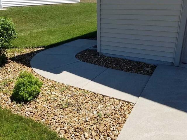 Uneven Concrete Sidewalk Lifted and Leveled in Lomira, WI - Before Photo