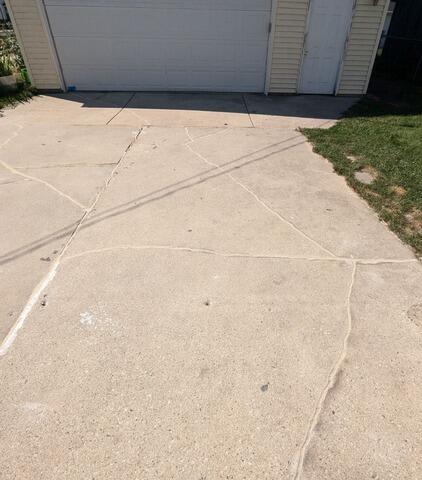 Severely Cracked Concrete Driveway Stabilized & Repaired in Sheboygan, WI - After Photo