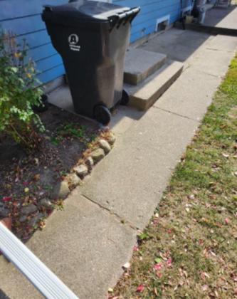 Sunken Concrete Walkway and Patio Lifted in Sheboygan, WI - Before Photo
