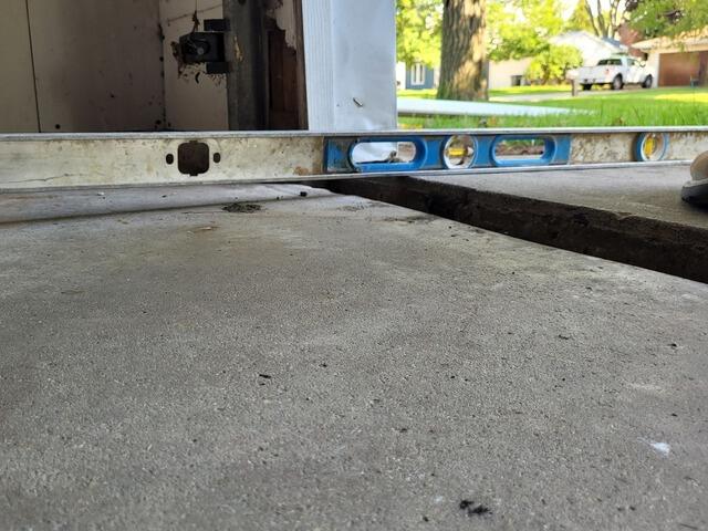 Cracked Concrete Garage Floor Repaired in Green Bay, WI - Before Photo
