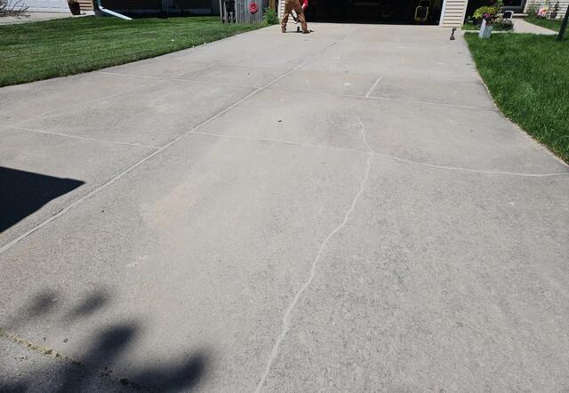 Uneven Sidewalk Leveled & Joints Sealed Using PolyLevel Foam  in Green Bay, WI - After Photo