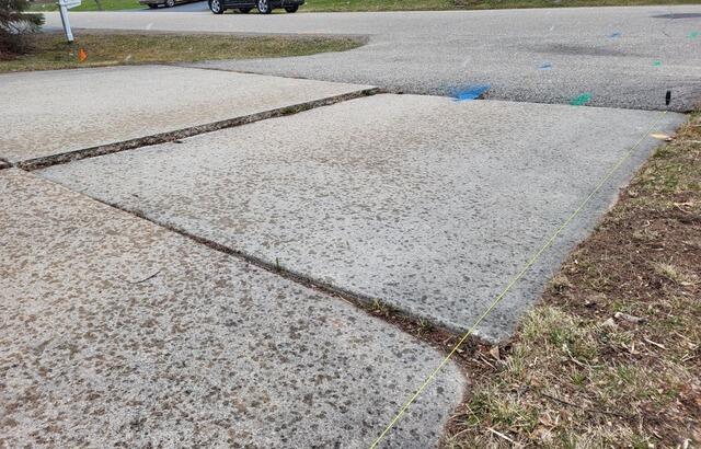 Uneven Concrete Garage Leveling & Joint Repair in Menasha, WI - Before Photo