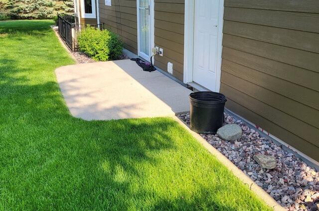 Concrete Patio Lifted, Leveled, Sealed & Repaired in Menasha, WI - Before Photo
