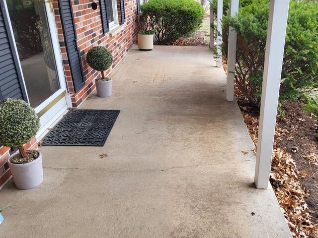 Cracked Concrete Patio lifted, Leveled, Repaired & Sealed in Stevens Point, WI - Before Photo