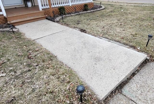 Sunken Concrete Walkway Lifted and Repaired in Oshkosh, WI - Before Photo