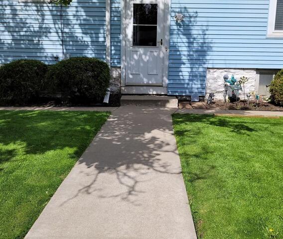 Sinking Concrete Walkway Repaired in Oshkosh, WI - Before Photo