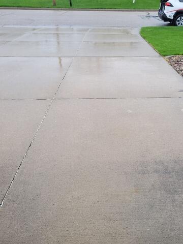 Concrete Driveway Lifted and Repaired in Neenah, WI - Before Photo