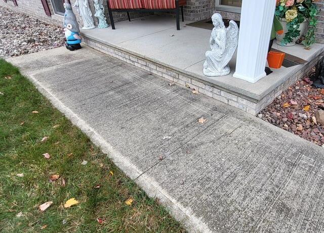 Cracked and Sunken Concrete Repaired in Escanaba, MI - Before Photo