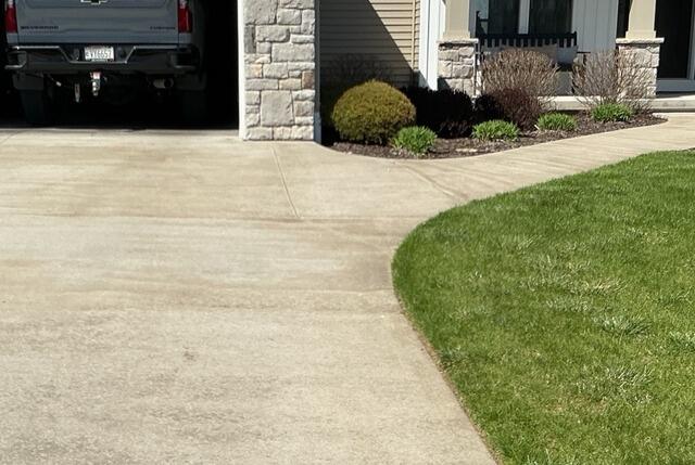Concrete Driveway and Walkway Lifted and Repaired in Hortonville, WI - Before Photo