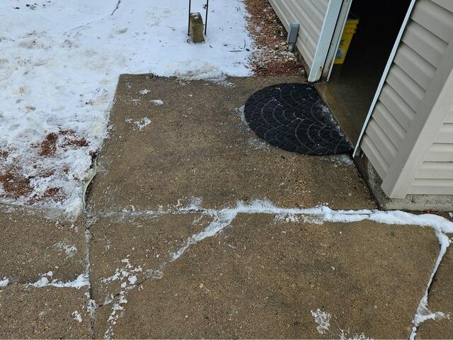 Concrete Driveway and Patio Repaired in Clintonville, WI - Before Photo