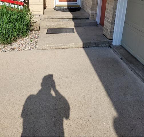 Concrete Driveway Lifted and Repaired in Oakfield, WI - Before Photo
