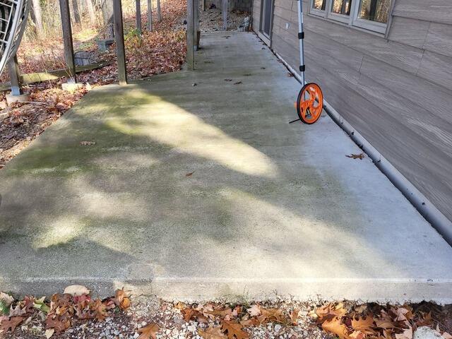 Concrete Patio Repaired & Lifted in Sturgeon Bay, WI - Before Photo
