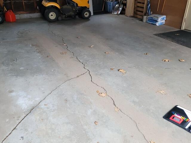 Cracked Concrete Garage Floor Repaired in Rhinelander, WI - Before Photo