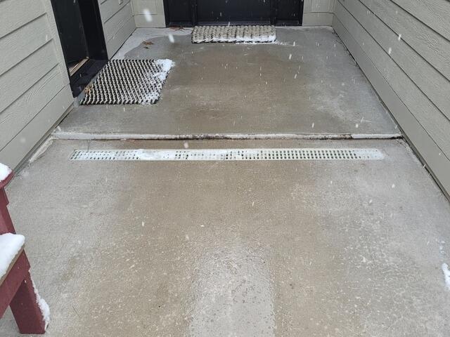 Cracked Concrete Walkway Lifted and Repaired in Rhinelander, WI - Before Photo