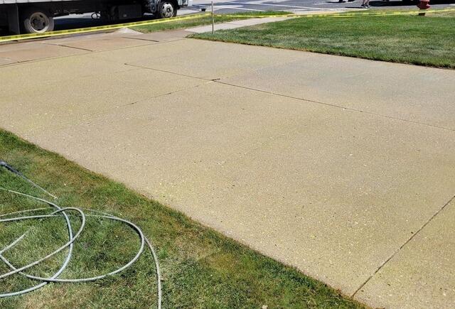 Failing Concrete Driveway Lifting, Sealing & Repair in Juneau, WI - After Photo