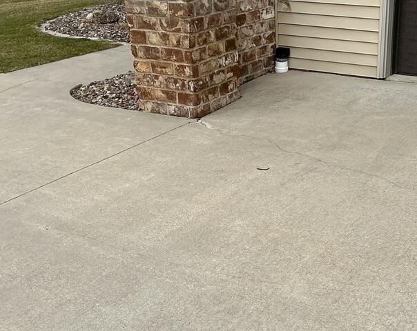 Cracking Concrete Driveway Repair in Appleton, WI - Before Photo