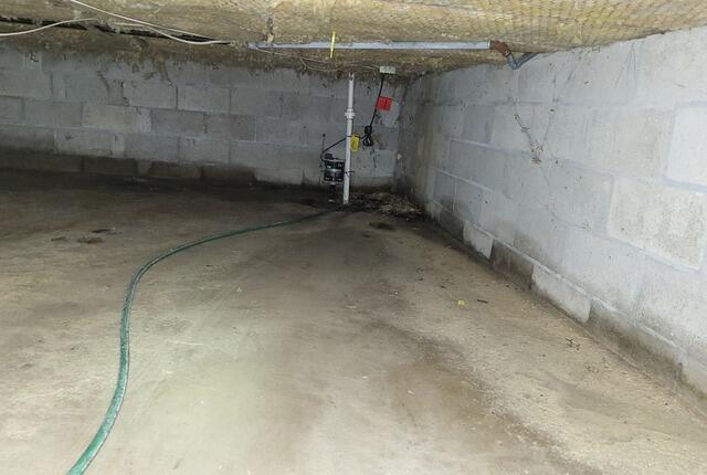 Musty Damp Crawlspace Repaired, Insulated and Stabilized in West Bend, WI - Before Photo